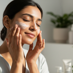 young Indian woman applying sunscreen